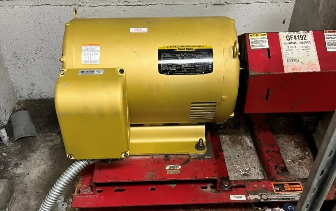 Chilled water system pump and pipework in a plant room